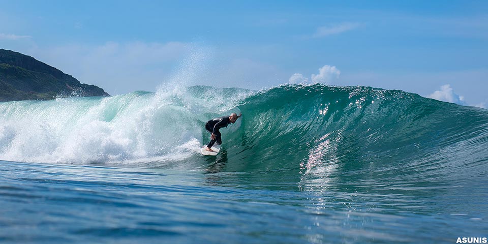 A lonely surfer in a sardinia west coast secret spot